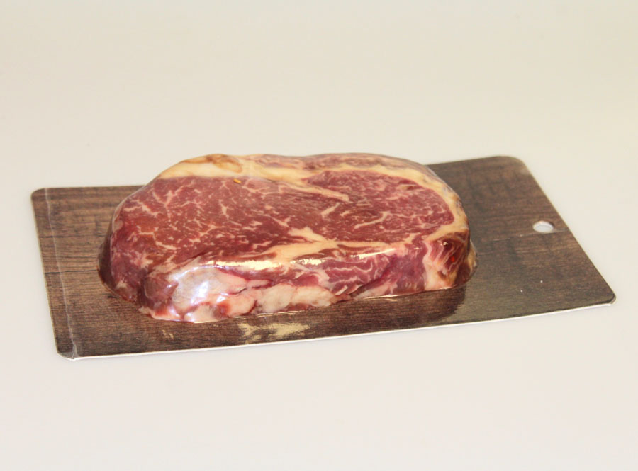 Steak in paper skin packaging