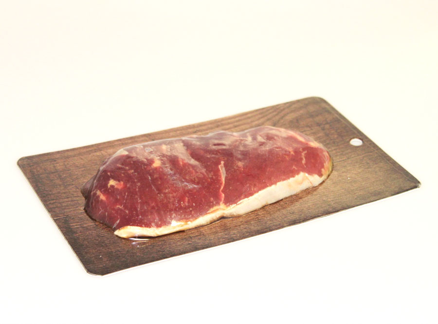 Steak in paper skin packaging